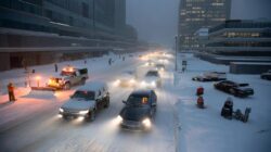 Heavy snow expected starting tonight as officials urge drivers to stay home and employers insist on business as usual